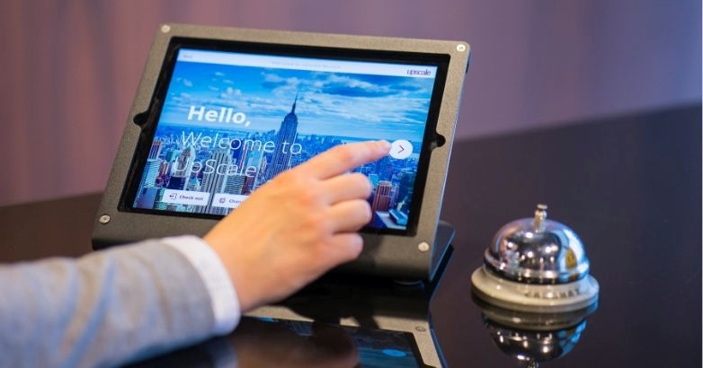 A person presents a hotel on an tablet, focusing on innovative marketing ideas with AI and automation in the hospitality industry.