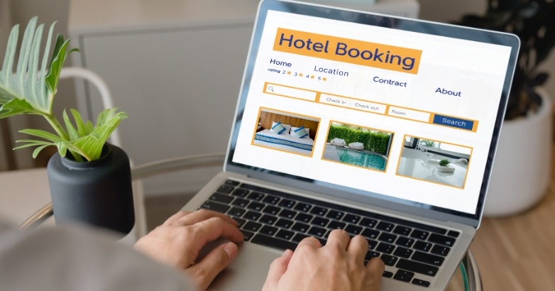 Hotel booking website displayed on a laptop, highlighting marketing KPIs and conversion rate metrics.