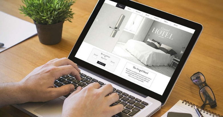 Travel website design best practices shown on laptop with hotel booking interface